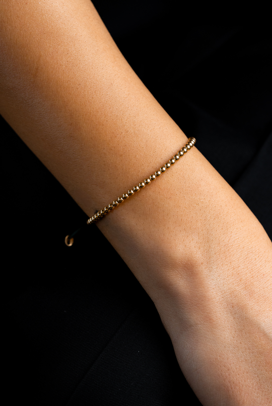 Pulseira às bolinhas em ouro amarelo com algodão azul