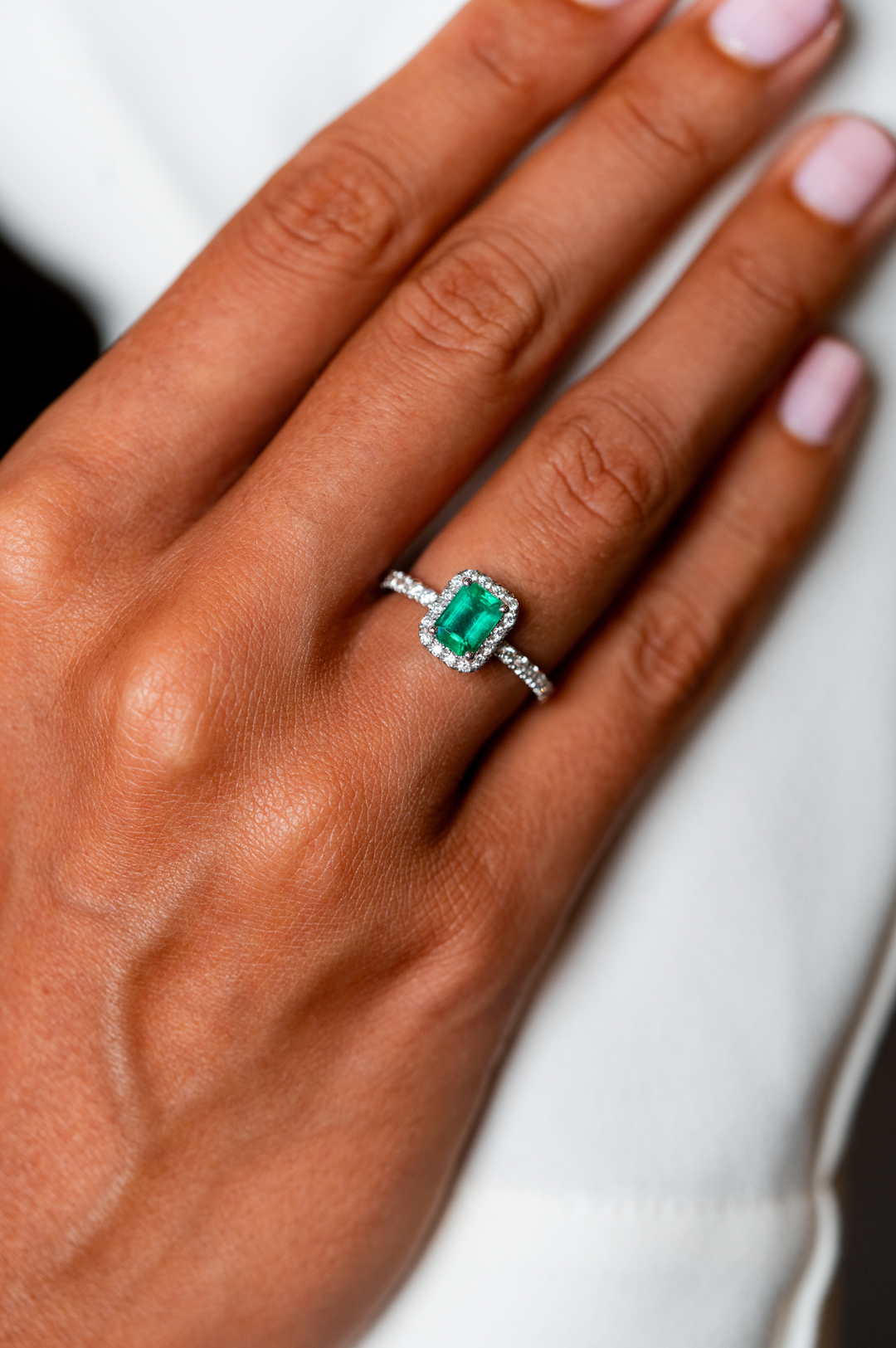 White Gold Engagement Ring with Diamonds and Emerald