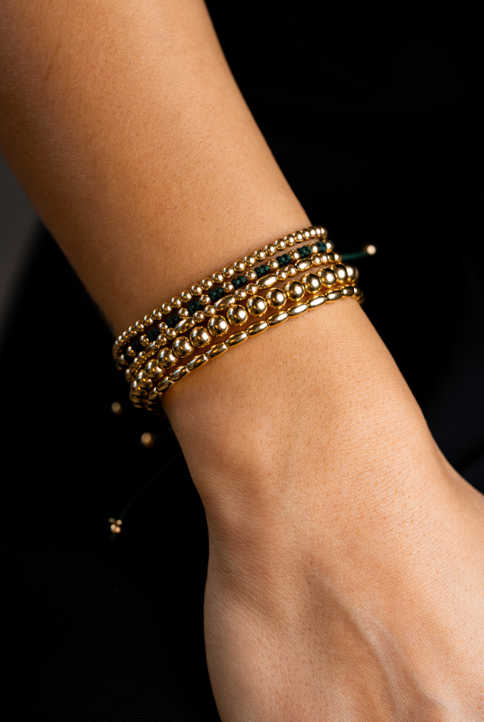 Pulseira em ouro amarelo com algodão verde escuro