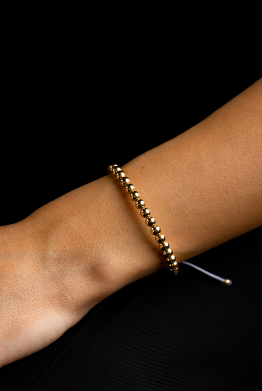 Pulseira às bolinhas em ouro amarelo com algodão lilás