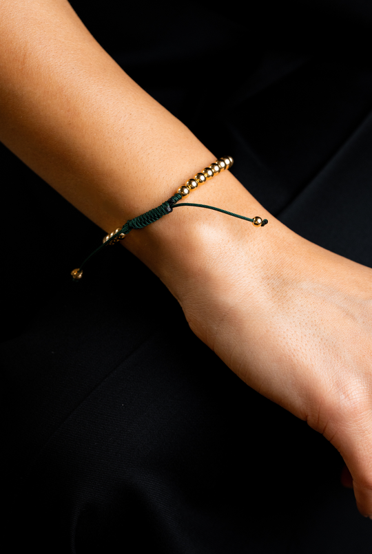 Pulseira às bolinhas em ouro amarelo com algodão verde escuro