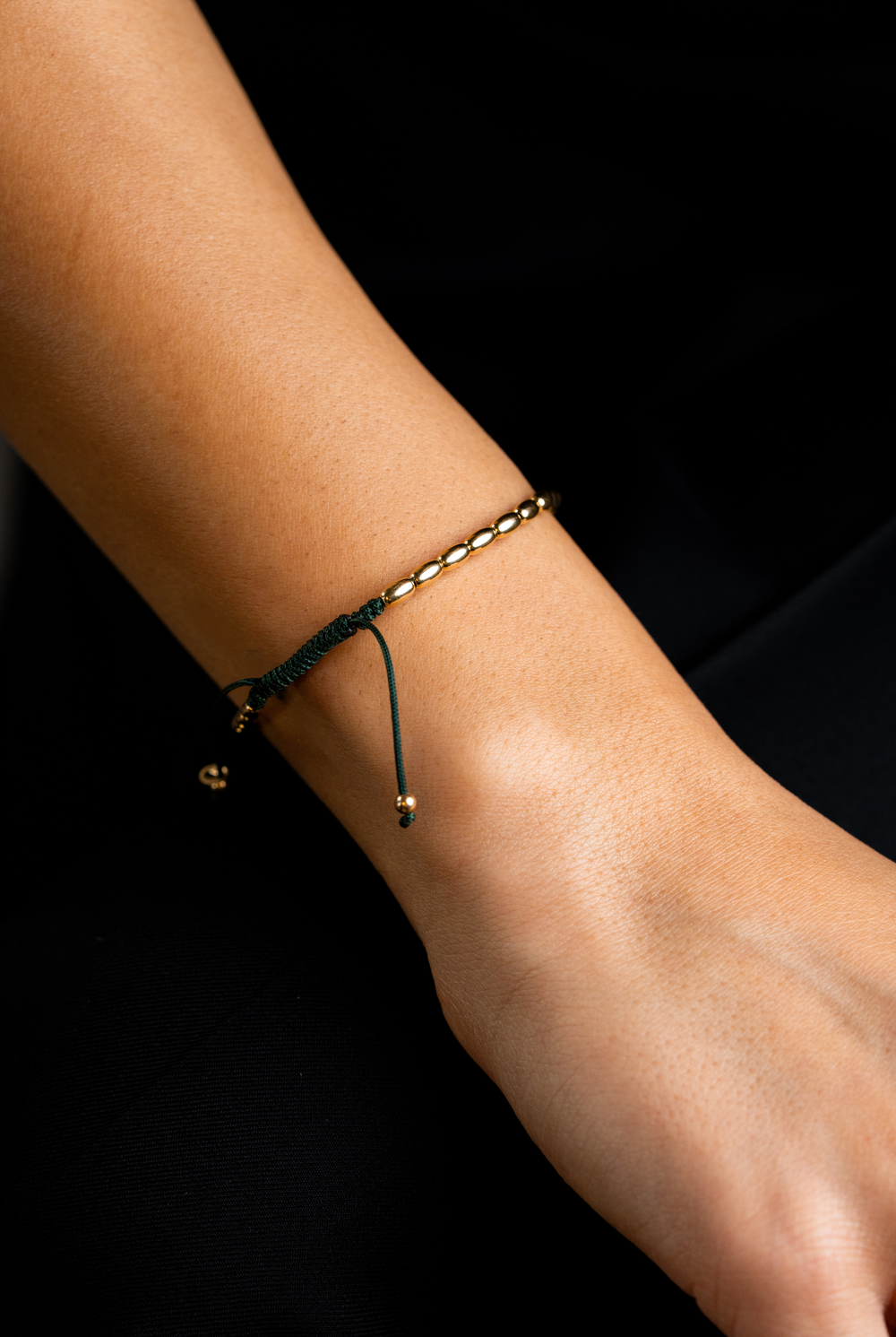 Pulseira em ouro amarelo com algodão verde