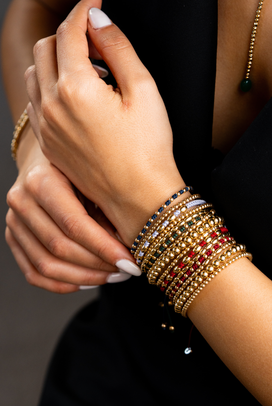 Pulseira às bolinhas em ouro amarelo com algodão lilás