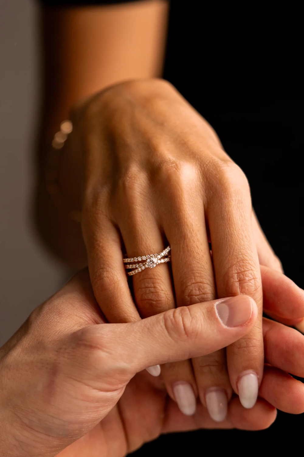 Pink gold engagement ring with 3 round diamonds